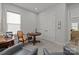 Spare bedroom being used as an office with an accent chair, side table and large storage closet at 7010 Brush Crk, Monroe, NC 28110