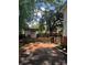 The backyard features a storage shed, driveway, and mature trees at 80 Pine St, Badin, NC 28009