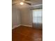 This bedroom features wood floors, neutral paint and good natural light at 80 Pine St, Badin, NC 28009