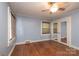 Inviting bedroom features hardwood floors, natural light, and classic design with white trim and a ceiling fan at 80 Pine St, Badin, NC 28009