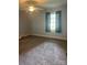 Cozy bedroom featuring neutral paint, carpet, and a ceiling fan to keep you comfortable year round at 80 Pine St, Badin, NC 28009