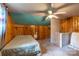 Another angle of the cozy bedroom showcasing the unique ceiling design and wood paneling at 80 Pine St, Badin, NC 28009