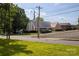 A large, one story brick building with a gray roof and a steeple on a sunny day at 80 Pine St, Badin, NC 28009