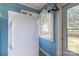 Bright kitchen area featuring an older refrigerator and natural light at 80 Pine St, Badin, NC 28009