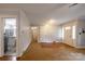 Inviting living room features a mix of carpet and hardwood flooring, neutral colors and lots of natural light at 80 Pine St, Badin, NC 28009