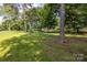 Community park with a playground and lush green space at 80 Pine St, Badin, NC 28009