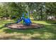 Community playground with bright blue slide and climbing structure for active fun at 80 Pine St, Badin, NC 28009