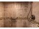 Tiled shower featuring a mosaic accent stripe and a mounted shower head at 80 Pine St, Badin, NC 28009