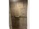 Tiled shower featuring a horizontal accent tile and shower caddy at 80 Pine St, Badin, NC 28009