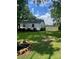 Well-maintained yard with lush green grass and tidy landscaping at 80 Pine St, Badin, NC 28009