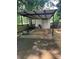 Backyard carport featuring a concrete foundation perfect for parking and storage at 80 Pine St, Badin, NC 28097