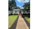Charming single-story home with a welcoming front porch and well-manicured lawn at 80 Pine St, Badin, NC 28097