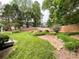 Spacious backyard featuring a wood fence, grass and landscaping at 8105 Rachel Ct, Waxhaw, NC 28173