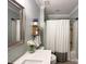 Clean bathroom featuring a single sink vanity, toilet and shower/tub combo at 8105 Rachel Ct, Waxhaw, NC 28173