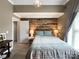 Bedroom featuring a decorative wood wall and stylish, modern lighting at 8105 Rachel Ct, Waxhaw, NC 28173