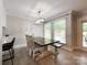 Bright dining area with hardwood floors, stylish chandelier, and natural light at 8105 Rachel Ct, Waxhaw, NC 28173