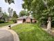 Beautifully landscaped brick home with a well-kept lawn and mature trees at 8105 Rachel Ct, Waxhaw, NC 28173