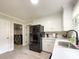 Bright kitchen featuring stainless steel appliances and white cabinetry at 8105 Rachel Ct, Waxhaw, NC 28173