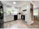 Modern kitchen with white cabinets, stainless steel appliances, and hardwood flooring at 8105 Rachel Ct, Waxhaw, NC 28173