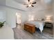 Spacious main bedroom with wood floors, a ceiling fan, and ample natural light at 8105 Rachel Ct, Waxhaw, NC 28173