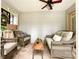 Inviting screened porch with cozy seating and a rustic wooden coffee table at 8105 Rachel Ct, Waxhaw, NC 28173
