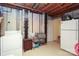 Unfinished basement featuring laundry appliances, storage space, and utilitarian design, ready for customization at 8306 Knights Bridge Rd, Charlotte, NC 28210