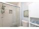 Bathroom featuring a modern glass shower with tiled walls and floors, offering a fresh design at 8306 Knights Bridge Rd, Charlotte, NC 28210