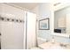 Cozy bathroom featuring a tub with white curtain and tiled walls, along with a stylish mirror and vanity at 8306 Knights Bridge Rd, Charlotte, NC 28210