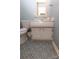 Bathroom featuring white vanity and beautifully patterned tile floor at 8306 Knights Bridge Rd, Charlotte, NC 28210