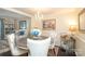 Elegant dining room features chandelier, dark wood floors, and seating for four at 8306 Knights Bridge Rd, Charlotte, NC 28210