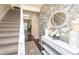 Welcoming foyer with floral wallpaper, mirror, and console table at 8306 Knights Bridge Rd, Charlotte, NC 28210