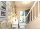 Inviting entryway with open door and stylish floral wallpaper at 8306 Knights Bridge Rd, Charlotte, NC 28210