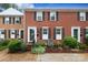 Charming brick townhome with black shutters and landscaped front yard at 8306 Knights Bridge Rd, Charlotte, NC 28210