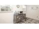 Kitchen nook with stylish gray buffet and decorative tile floor at 8306 Knights Bridge Rd, Charlotte, NC 28210