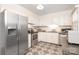 Bright kitchen featuring stainless steel appliances and decorative tile floor at 8306 Knights Bridge Rd, Charlotte, NC 28210