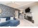 Bright living room featuring a decorative fireplace and a stylish floral patterned accent wall, blending modern design at 8306 Knights Bridge Rd, Charlotte, NC 28210