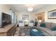 Spacious living room with hardwood floors and built-in shelves at 8306 Knights Bridge Rd, Charlotte, NC 28210