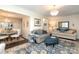Cozy living room with hardwood floors and elegant chandelier at 8306 Knights Bridge Rd, Charlotte, NC 28210