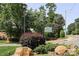 Street view of a neighborhood entrance sign with lush landscaping at 8306 Knights Bridge Rd, Charlotte, NC 28210