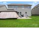 Expansive backyard featuring a patio, grill, and gazebo, offering a fantastic space for outdoor activities and leisure at 8347 Dallas Bay Rd, Charlotte, NC 28278