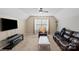 Well-lit bedroom with vaulted ceiling, ceiling fan, and comfortable seating area at 8347 Dallas Bay Rd, Charlotte, NC 28278