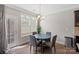 Bright breakfast nook with a round table, seating for four, hardwood floors, and natural light at 8347 Dallas Bay Rd, Charlotte, NC 28278