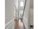 Welcoming foyer with hardwood floors, chair rail, and a view into the living spaces at 8347 Dallas Bay Rd, Charlotte, NC 28278