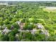 Overhead view of a community with mature trees and a mix of houses, showcasing a peaceful environment at 84 Sumner Nw Ave, Concord, NC 28027
