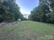 Open backyard with views of the lot lines at 84 Sumner Nw Ave, Concord, NC 28027