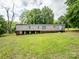 Exterior shot of a one-story home with a lush lawn at 84 Sumner Nw Ave, Concord, NC 28027