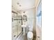 Bathroom featuring pedestal sink, glass enclosed shower, and modern fixtures at 901 Scaleybark Rd, Charlotte, NC 28209