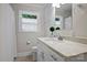 Bathroom with a quartz countertop vanity, large mirror, toilet, and a shower with a white curtain at 901 Scaleybark Rd, Charlotte, NC 28209