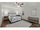 Cozy bedroom with hardwood floors features neutral decor and a metal bed frame at 901 Scaleybark Rd, Charlotte, NC 28209