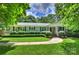 Charming single-story home with manicured lawn, walkway, and inviting front porch at 901 Scaleybark Rd, Charlotte, NC 28209